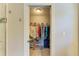 Walk-in closet features ample hanging space and wire basket storage at 5551 Allamanda Ave, North Port, FL 34288