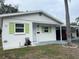 Cute bungalow style home with green shutters and carport at 6067 Arlene Way, Bradenton, FL 34207