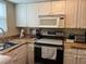 Cozy kitchen with wood countertops and stainless steel appliances at 6067 Arlene Way, Bradenton, FL 34207