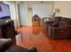 Living room with hardwood floors and brown recliner at 6067 Arlene Way, Bradenton, FL 34207