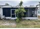 Spacious screened porch with a patio and lush green landscaping at 6067 Arlene Way, Bradenton, FL 34207