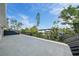 Private balcony with tile flooring and metal railing at 656 Tropical Cir, Sarasota, FL 34242