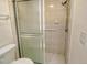 Bathroom with shower stall, toilet and tiled walls at 6947 Woodwind Dr # 77, Sarasota, FL 34231