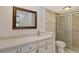 Bathroom with updated vanity, shower, and toilet at 6947 Woodwind Dr # 77, Sarasota, FL 34231