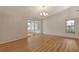 Bright dining room with wood floors and sliding glass doors at 6947 Woodwind Dr # 77, Sarasota, FL 34231