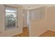 Bright entryway with wood floors and a view to the outside at 6947 Woodwind Dr # 77, Sarasota, FL 34231