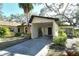 House exterior showcasing carport and landscaping at 6947 Woodwind Dr # 77, Sarasota, FL 34231