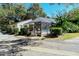 Community pool area with screened enclosure at 6947 Woodwind Dr # 77, Sarasota, FL 34231