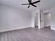 Spacious bedroom with grey flooring and a large closet at 7724 Us Open Loop, Lakewood Ranch, FL 34202