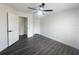 Spacious bedroom with ceiling fan and gray flooring at 7724 Us Open Loop, Lakewood Ranch, FL 34202