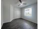 Bright bedroom with ceiling fan, gray flooring and double door closet at 7724 Us Open Loop, Lakewood Ranch, FL 34202