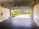 Attached garage with automatic opener and view of backyard at 7724 Us Open Loop, Lakewood Ranch, FL 34202