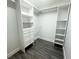 Large walk-in closet with ample shelving and drawers at 7724 Us Open Loop, Lakewood Ranch, FL 34202