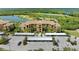 Aerial view of the building including views of the parking and landscaping at 8403 Grand Estuary Trl # 301, Bradenton, FL 34212