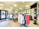 Retail space features clothing racks, displays, and an exit door, offering shopping conveniences for residents and guests at 8403 Grand Estuary Trl # 301, Bradenton, FL 34212