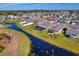 Aerial view showcasing a home with a pool and canal-front location at 8547 40Th E Cir, Palmetto, FL 34221