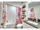 Bathroom with a tub, shower, and flamingo decor at 8547 40Th E Cir, Palmetto, FL 34221