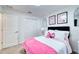 Bedroom with a full-size bed and pink accents at 8547 40Th E Cir, Palmetto, FL 34221