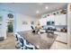 Well-equipped kitchen featuring white cabinetry and a large kitchen island at 8547 40Th E Cir, Palmetto, FL 34221