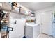 Bright laundry room with washer, dryer, and shelving at 8547 40Th E Cir, Palmetto, FL 34221