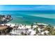 Aerial view showcasing beach, water, and boat at 9 Sandy Cove Rd # 8A, Sarasota, FL 34242