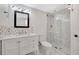 Modern bathroom with white vanity and tile shower at 9 Sandy Cove Rd # 8A, Sarasota, FL 34242