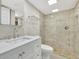 Updated bathroom with a walk-in shower and white vanity at 9 Sandy Cove Rd # 8A, Sarasota, FL 34242