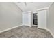 Well-lit bedroom with double closets and tile flooring at 9 Sandy Cove Rd # 8A, Sarasota, FL 34242