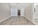 Bright bedroom with tile floors and double closets at 9 Sandy Cove Rd # 8A, Sarasota, FL 34242