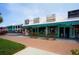 Street-level commercial building with multiple storefronts and ample parking at 9 Sandy Cove Rd # 8A, Sarasota, FL 34242