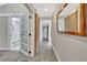 Hallway with tile flooring, French doors, and mirror at 9 Sandy Cove Rd # 8A, Sarasota, FL 34242