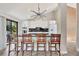 Updated kitchen featuring white cabinetry, breakfast bar, and black countertops at 9 Sandy Cove Rd # 8A, Sarasota, FL 34242