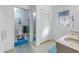 Bathroom with double vanity, linen closet, and toilet at 1006 Pine Forest Ct, Venice, FL 34293