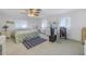 Bedroom with bed, dresser, and television at 1006 Pine Forest Ct, Venice, FL 34293