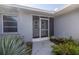 Front entrance with double doors and screen at 1006 Pine Forest Ct, Venice, FL 34293