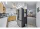 Stainless steel refrigerator in a bright kitchen at 1006 Pine Forest Ct, Venice, FL 34293