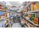 Well-stocked pantry with ample shelving at 1006 Pine Forest Ct, Venice, FL 34293