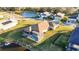 Aerial view of house with pool and fenced backyard, located in a quiet community at 12822 Rainwashed Loop, Parrish, FL 34219