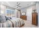 Relaxing bedroom with a king-size bed and built-in dresser at 12822 Rainwashed Loop, Parrish, FL 34219