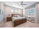 Main bedroom with large window and stylish decor at 12822 Rainwashed Loop, Parrish, FL 34219