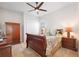 Bedroom with a sleigh bed and wood furniture at 12822 Rainwashed Loop, Parrish, FL 34219