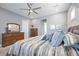 Bright bedroom featuring a comfortable bed and ceiling fan at 12822 Rainwashed Loop, Parrish, FL 34219