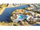 Community pool, basketball court, and playground near a lake at 12822 Rainwashed Loop, Parrish, FL 34219