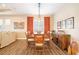 Dining area with wood table, chairs, and an elegant chandelier at 12822 Rainwashed Loop, Parrish, FL 34219