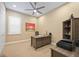 Home office with desk, chair, and built-in shelving at 12822 Rainwashed Loop, Parrish, FL 34219