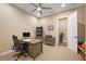 Bright home office features built-in shelving and a large desk at 12822 Rainwashed Loop, Parrish, FL 34219