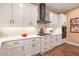 Well-equipped kitchen with stainless steel appliances and white cabinetry at 12822 Rainwashed Loop, Parrish, FL 34219