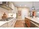 Bright kitchen featuring white cabinets and stainless steel appliances at 12822 Rainwashed Loop, Parrish, FL 34219