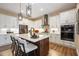 Updated kitchen featuring white cabinets and a center island at 12822 Rainwashed Loop, Parrish, FL 34219