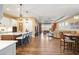 Modern kitchen with island, white cabinets, and stainless steel appliances at 12822 Rainwashed Loop, Parrish, FL 34219